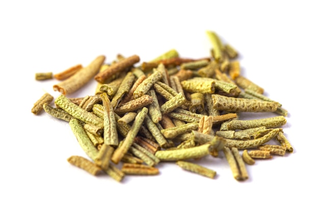 Pile of dried rosemary leaves isolated on white surface