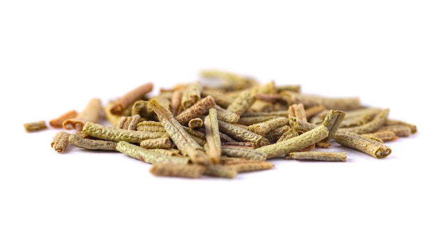 Pile of dried rosemary leaves isolated on white surface