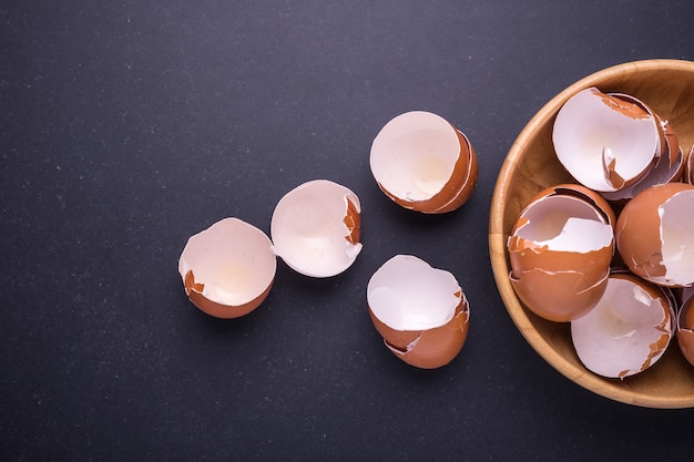 Pile of egg shell in wooden bowl