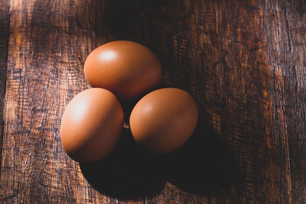 Pile of eggs on rustic wood closeup image