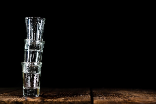 Pile of empty shot glasses