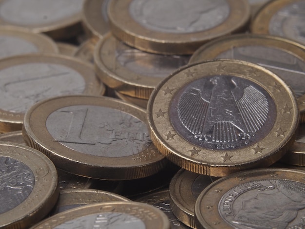 A pile of euro coins with the words euro on the top.