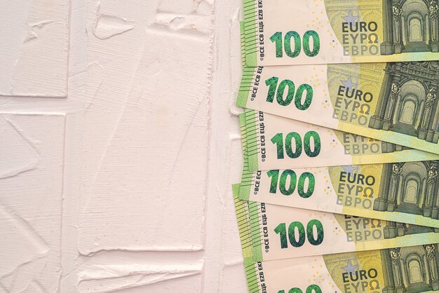 Photo pile of european currency 100 hundred banknotes, new. finance concept