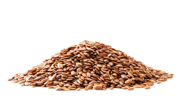 Pile of flax seeds close up. Isolated.