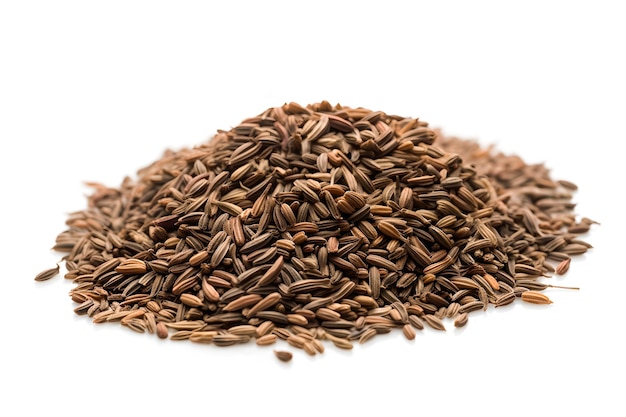 A pile of flax seeds on a white background