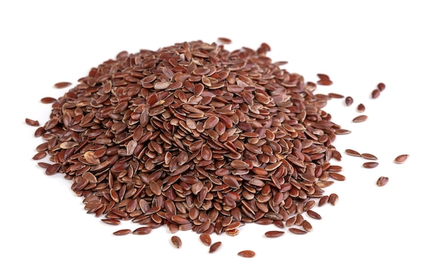 Pile of flax seeds on white