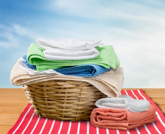 Pile of fluffy colorful towels on table