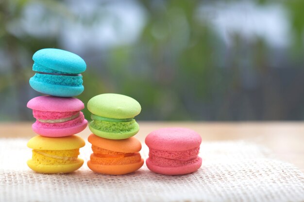 Pile of french colorful macarons on table.