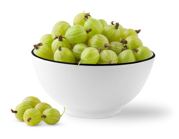 Pile of fresh green gooseberries in a bowl isolated on white space