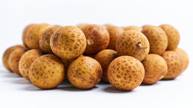 a pile of fresh longan fruit