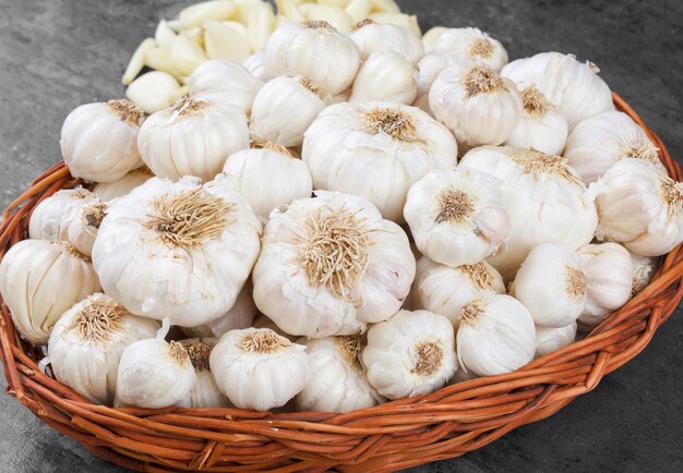 Pile of Fresh Organic Garlic on Vintage Wooden Background