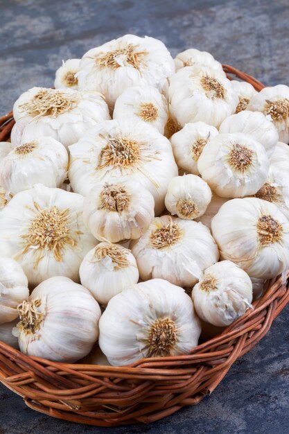 Pile of Fresh Organic Garlic on Vintage Wooden Background