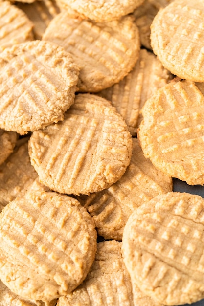 Pile of freshly baked peanut butter cookies.