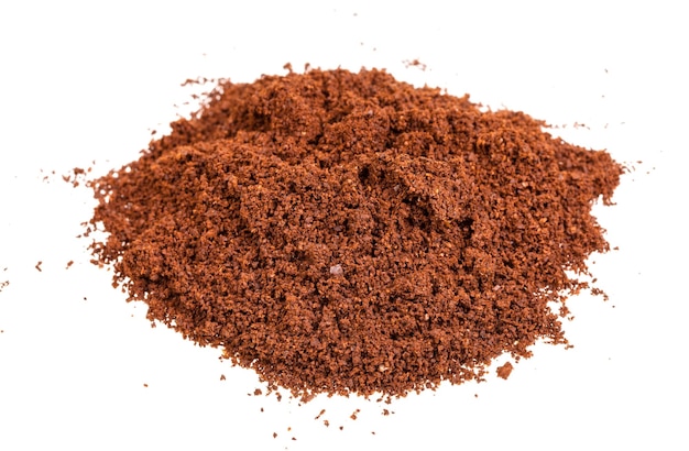 Pile of freshly ground coffee isolated on white