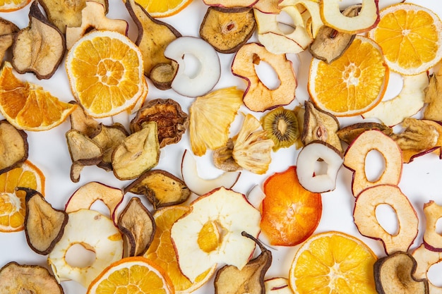 A pile of fruit and nuts are shown with the word apple on it.