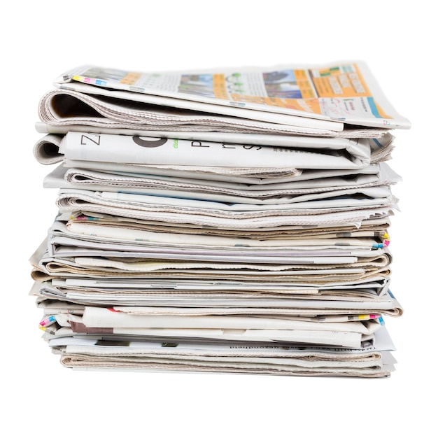 Pile of generic newspapers isolated on white background