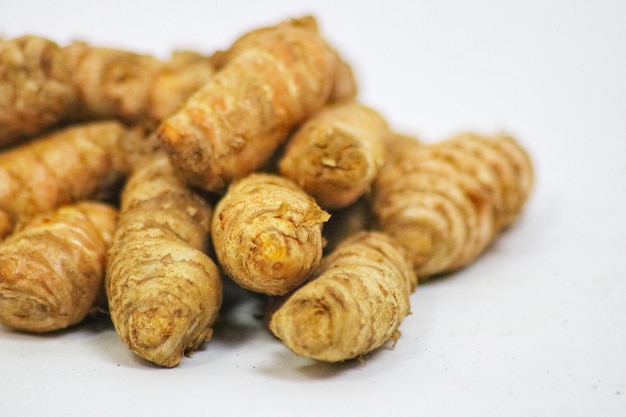 A pile of ginger on a white background