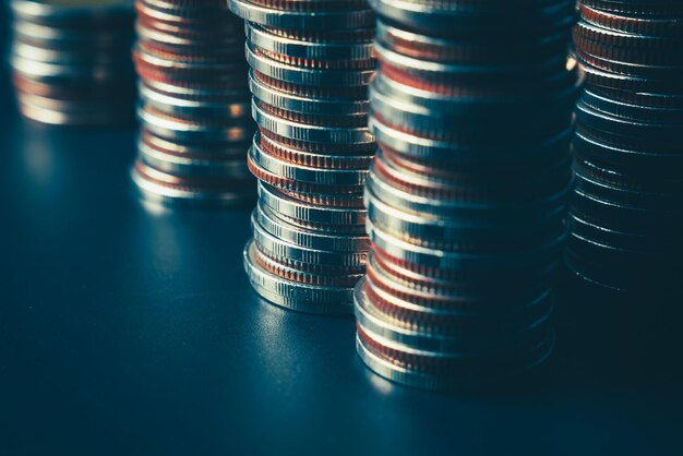 Pile of gold coins stack in finance treasury deposit bank account for saving