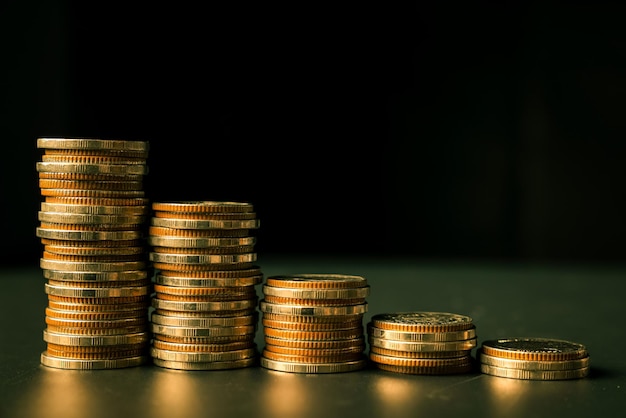 Pile of gold coins stack in finance treasury deposit bank account for saving