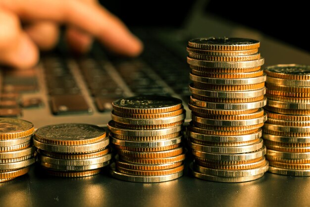 Pile of gold coins stack in finance treasury deposit bank account for saving