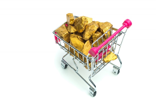 Pile of gold nuggets or gold ore in shopping cart or supermarket trolley on white background