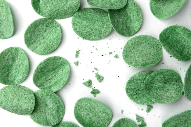 Pile of green potato chips with green onion isolated on white background.