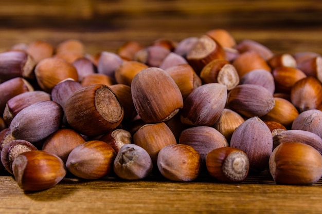 Pile of the hazelnuts on wooden table