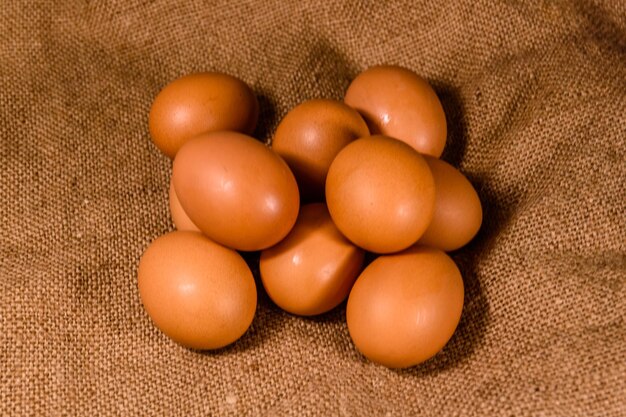 Pile of the hen eggs on sackcloth