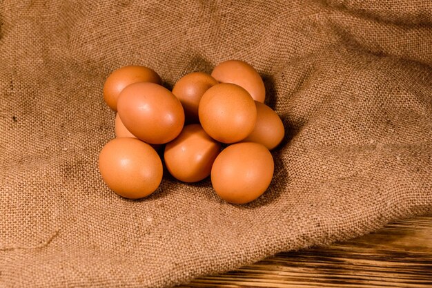 Pile of the hen eggs on sackcloth