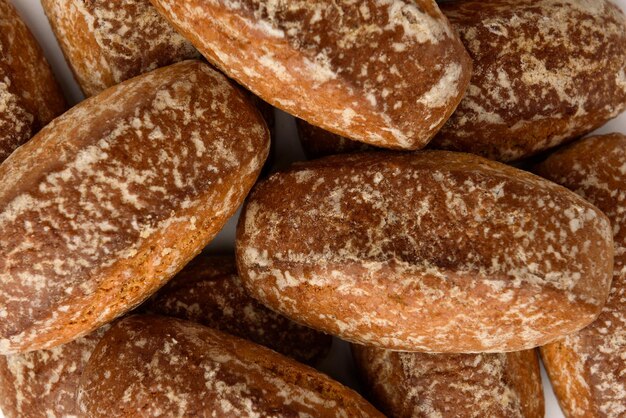 Pile of honey gingerbread cookies isolated on white background