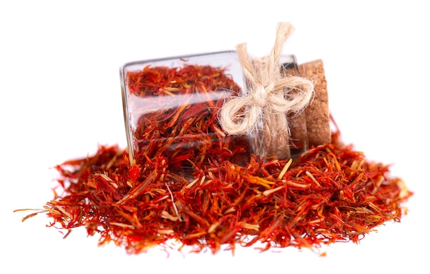 Pile of Imeretian Saffron in glass jar isolated on white background Dried saffron spice