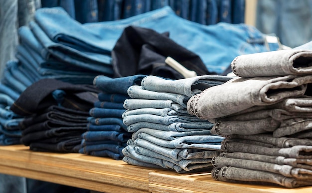 Pile of jeans on the shelf