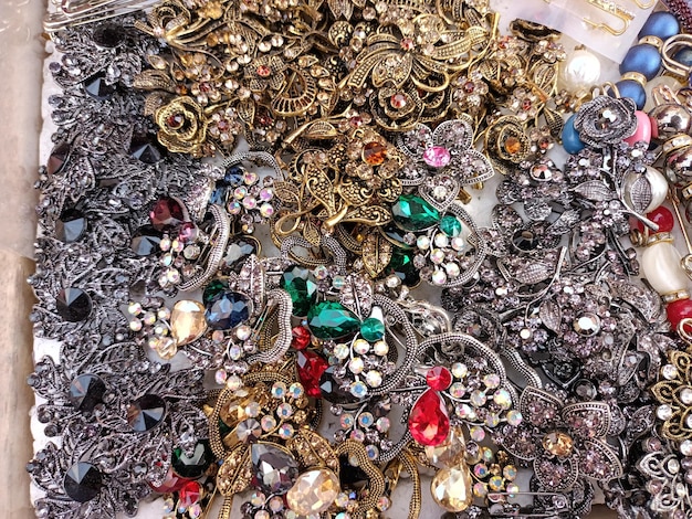 A pile of jewelry including one that has a diamond New Photo