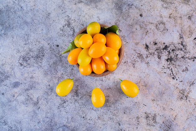 Pile of kumquats on rustic.