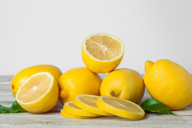 Pile of lemons on wooden table