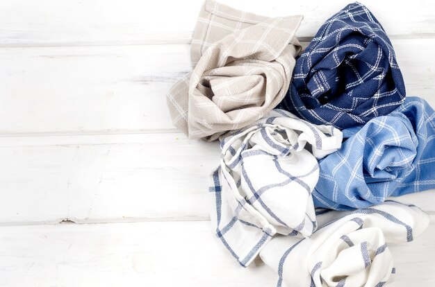 Pile of linen kitchen napkin on white