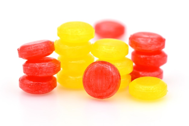 Pile of lozenges candy on white background