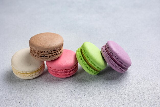 A pile of macaroons on a gray background