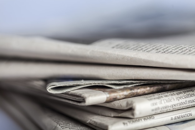 Pile of newspapers on  background close up