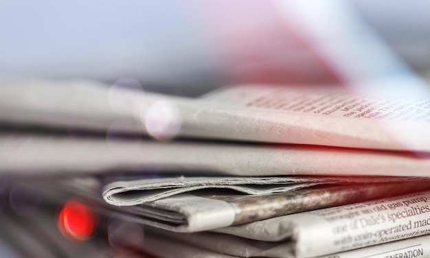 Pile of newspapers on  background close up