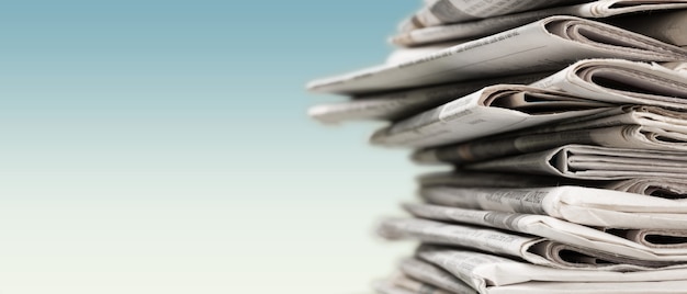 Pile of newspapers stack on background