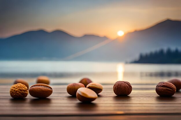 A pile of nuts on a wooden deck with mountains in the background