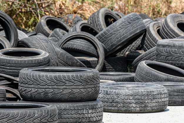 Pile of old car tires on the ground