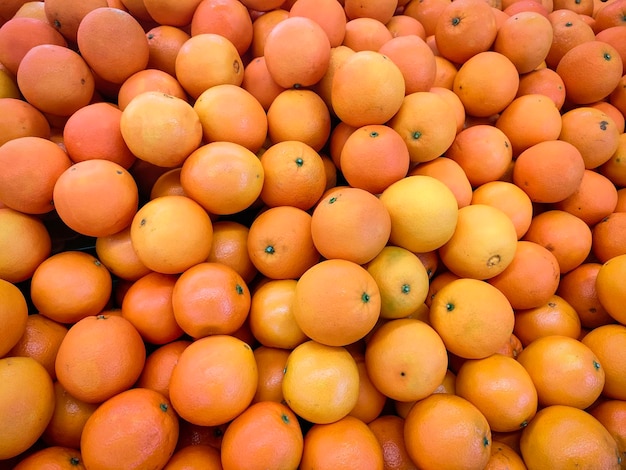 Pile of oranges, Fresh orange for sale in the market, top view background