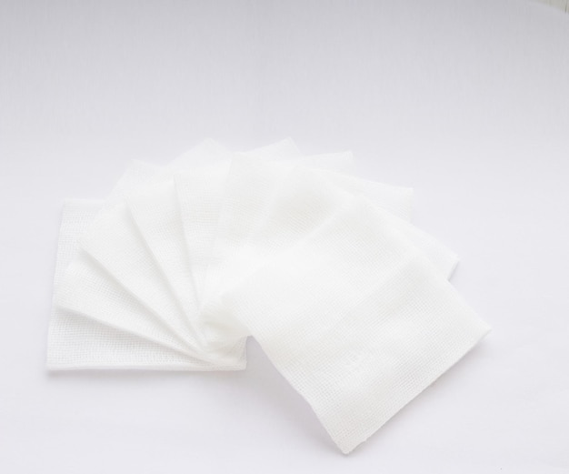 Pile of pad gauzes on white background in fan shape