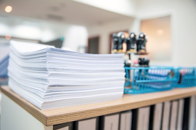 Pile of a paper on office desk stacked.