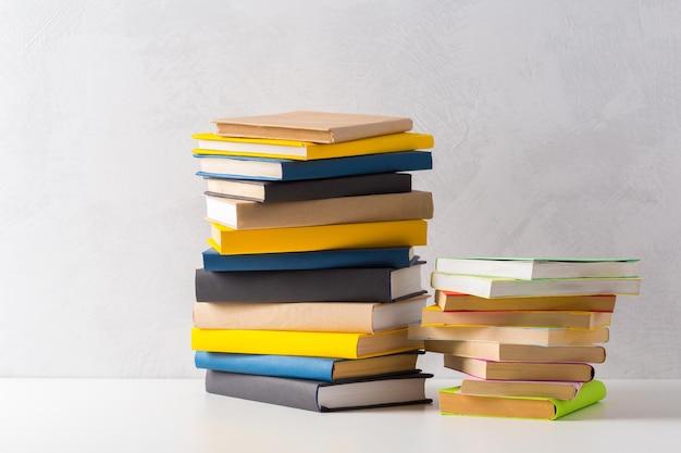 Pile of paperback books on a table