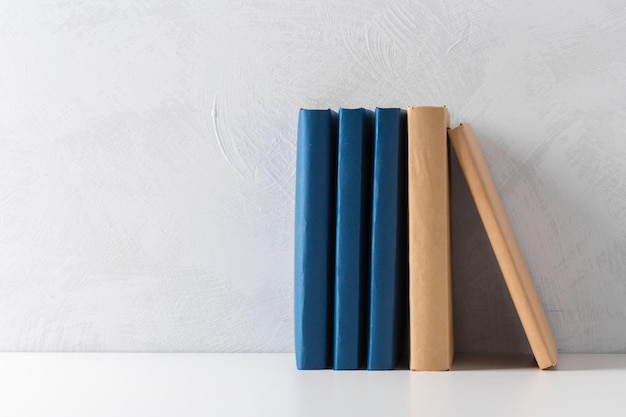 Pile of paperback books on a table