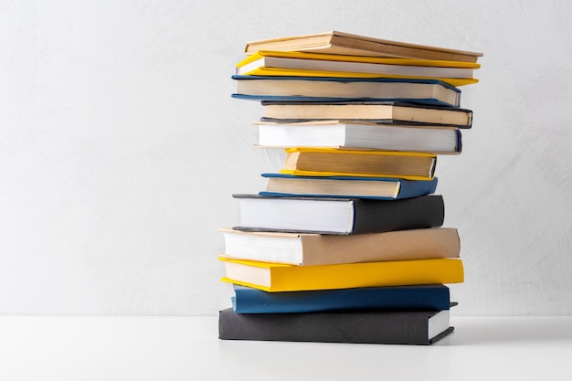 Pile of paperback books on a table