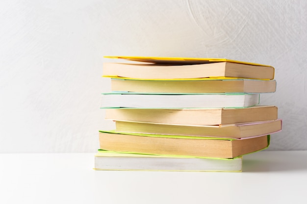  pile of paperback books on a table